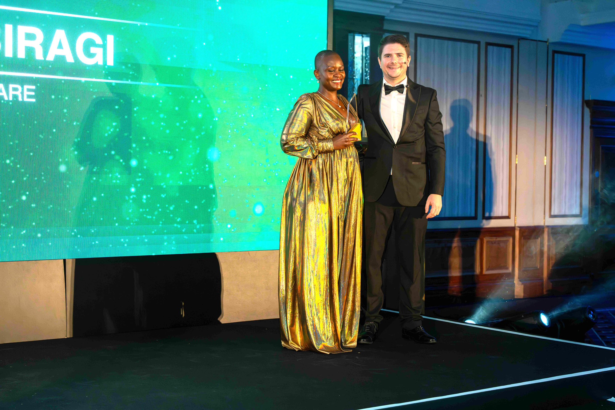 Lausa Biragi Recieving The Executive Of The Year Leaders in Care Awards 2025